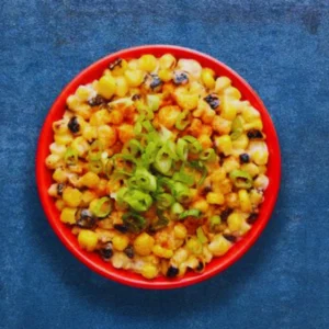 Smoky sweetcorn in a creamy, garlicky sauce topped with fresh spring onions and a sprinkle of PERi-Salt.
